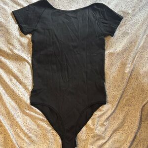 Lululemon Black bodysuit with Low Scoop back. Size medium